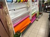 a large display of plants in a store with many colors on it
