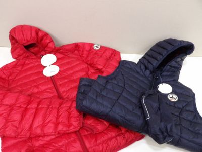 a red and blue jacket on a white table