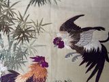 a painting of roosters and bamboo trees on the wall