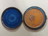a small blue box with a coin inside of it