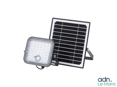 a close up of a solar powered flood light with a white background