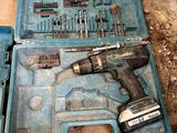 a blue tool box with tools in it on the ground