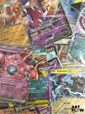 a lot of pokemon cards sitting on a table
