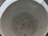 a white bowl with blue and red designs on it