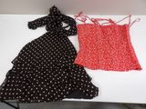 two dresses are sitting on a table next to each other