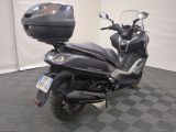 a scooter that is parked in a garage