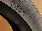 the tire of a car that is sitting on top of a cardboard box