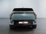 the rear end of a blue electric car in a white room