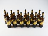 six bottles of wine lined up in a row on a white surface