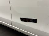 a sticker on the side of a white car