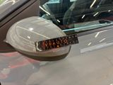 a sticker on the side mirror of a car