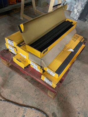 a close up of a machine that is sitting on top of a pallet