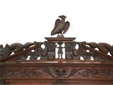 two birds perched on top of a wooden shelf