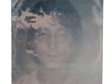 an image of a picture of a woman with glasses and a tree in the background