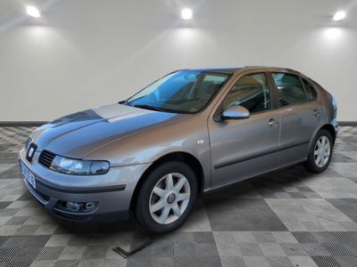 a picture of a silver car parked in a garage