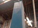 a blue sign hanging from the ceiling of a building