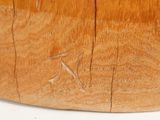 a close up of a wooden bowl on a table