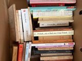 a box full of books sitting on top of a table