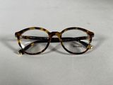 the glasses are made of tortoises and have a gold rim