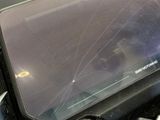a broken screen on the back of a laptop computer