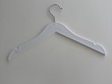 the white hanger is hanging on the wall next to the wall