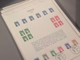 a book with stamps on it sitting on a table
