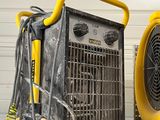 a yellow blower sitting on top of a table next to a blower