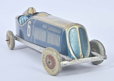 a blue toy car that is sitting on a white surface