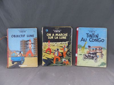trois livres pour enfants sont alignés sur une surface grise