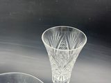 three glass vases sitting on a table next to each other