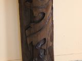 a wooden carving on the wall of a room