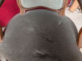 an old chair that has been upholstered and is in the process of reupholing