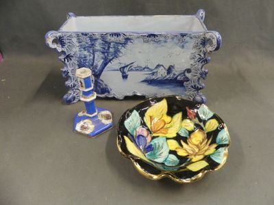 a blue and white vase and a plate with flowers on it