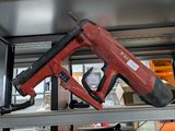a picture of a stapler on a shelf in a room