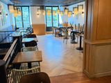 an image of a restaurant with a bar and chairs