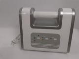 a silver and white machine that is sitting on a table