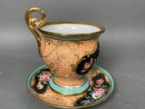 an image of a cup and saucer sitting on a saucer