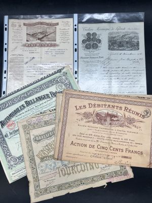 several different types of certificates are displayed on a black surface