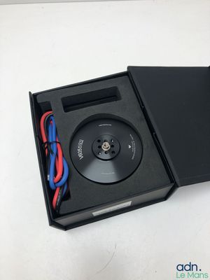 an open box with a cd player inside of it on a white surface