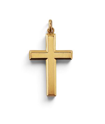 a gold cross pendant on a white background