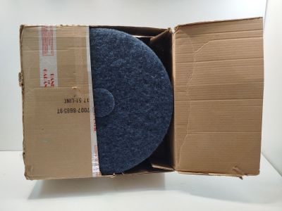 a cardboard box with a blue disc inside of it