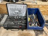 many tools in a tool box sitting on the floor
