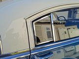 an image of a car that is parked in front of a house