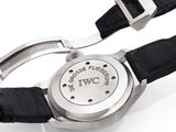 a watch with a black leather strap and a white dial