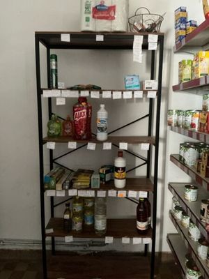 a rack of food in a store with labels on it