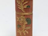 a small wooden box with a design on it