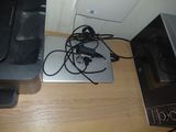 a laptop and a printer sitting on a desk