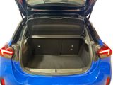 the back of a blue car with its trunk open showing the trunk space
