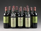 six bottles of wine are lined up in a row on a table