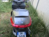 a motorcycle that is parked next to a building